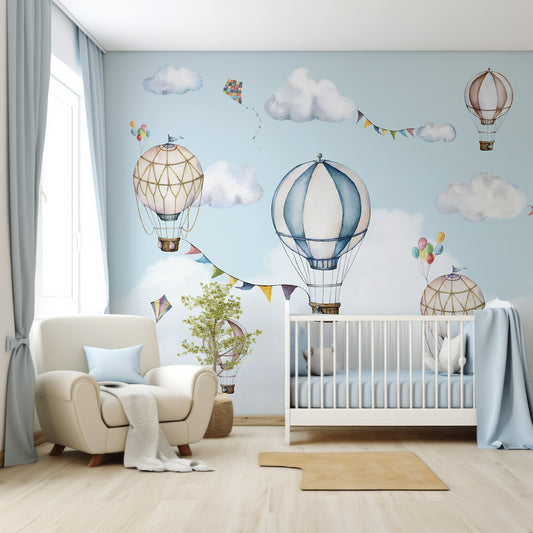 Balloons Wallpaper In Nursery With White Cot And Large Cream Chair With Blue Cushions And Blue Bedding