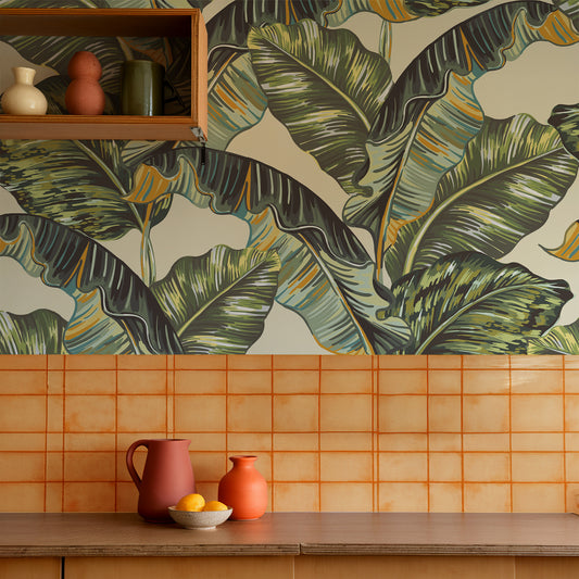 Banana Leaf in boho-style kitchen with orange tiled backsplash