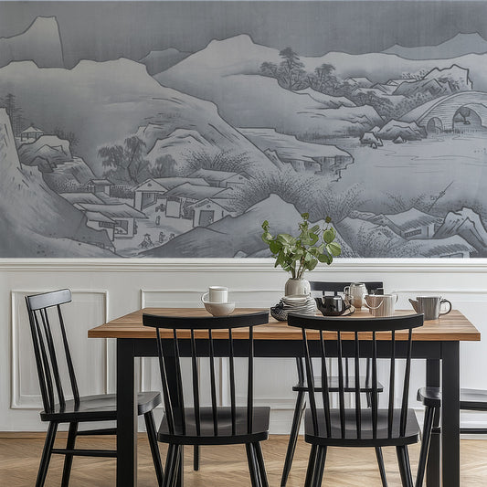 Inaka in dining room with black chairs and white panelling