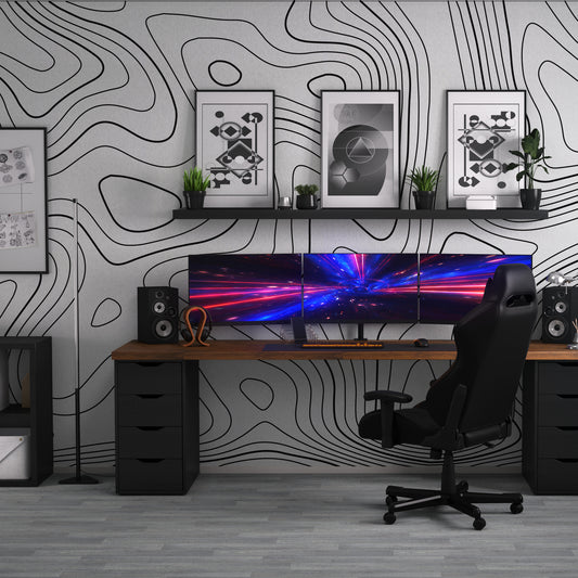 Inglans with black and wood desk with monitors and gaming chair