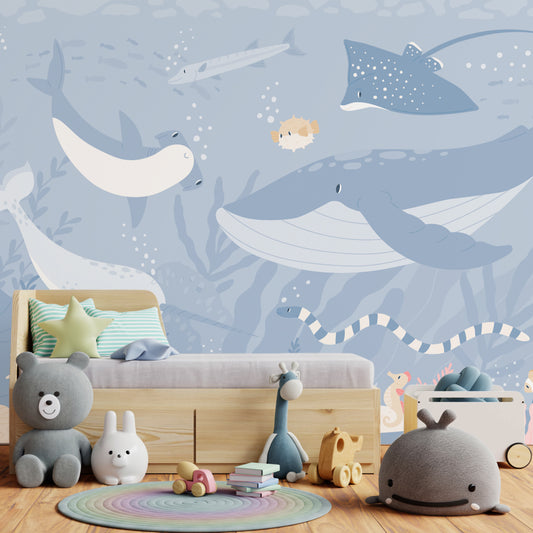 Submerged Fantasia wallpaper in children's bedroom with small bed with grey bedding and lots of stuffed toys