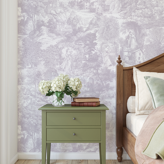 Green nightstand with flowers against a floral wallpapered wall.