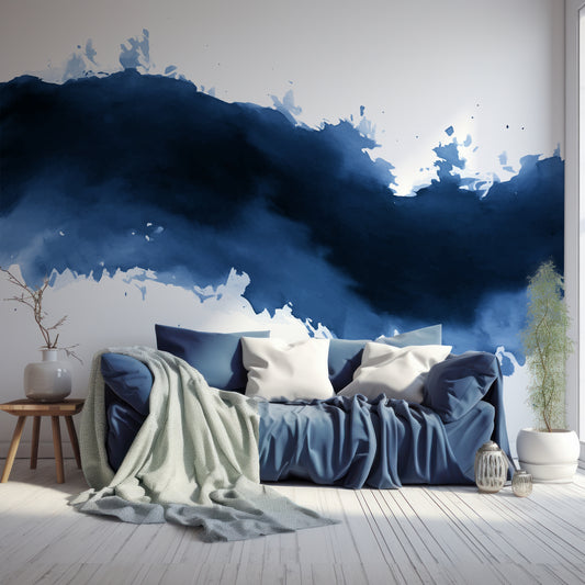 Wave Wallpaper In Living Room With Wooden Floor, Windows, Plants And Large Blue Sofa With Green Blankets And Grey Cushions