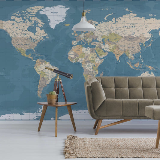 Blue World Map Wallpaper Mural with a couch and telescope in front | WallpaperMural.com