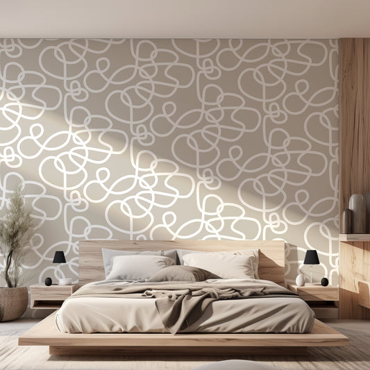 Abstract Curls Neutral Wallpaper In Bedroom With Wooden Bed, Grey Neutral Bedding, Black Lamps, Large Green Plant