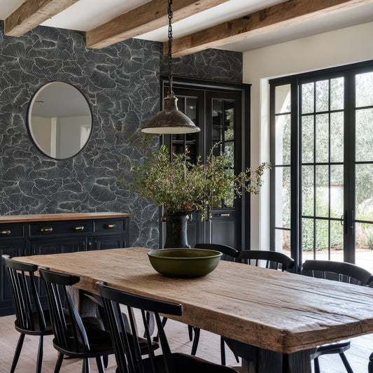 Chanterelle Wallpaper in a Dining room with wooden table, black chairs against a navy detailed floral wall.