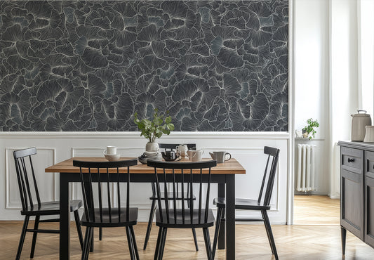 Chanterelle Wallpaper in a Dining area with a wooden table and black chairs against a detailed navy floral wall 