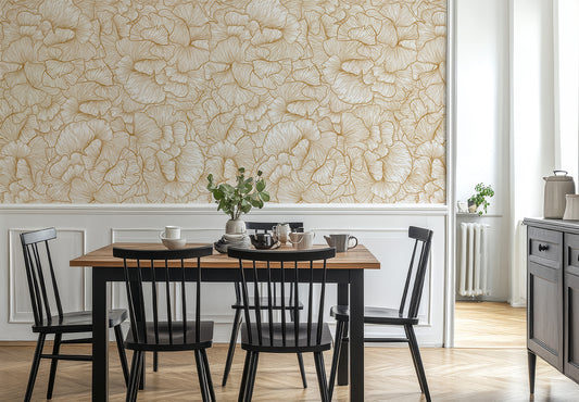 Chanterelle Gold Wallpaper in a Dining area with a wooden table and black chairs against a floral wall.
