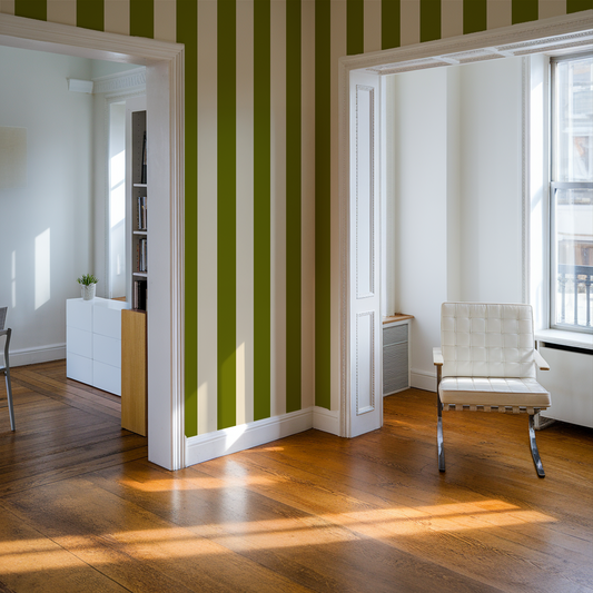 Modern room with green and white striped wallpaper, wooden floor, and a chair.