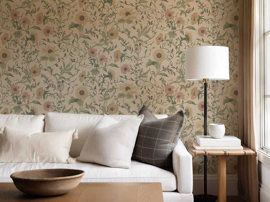Living room with the Clytie floral wallpaper, white sofa, and side table with lamp.