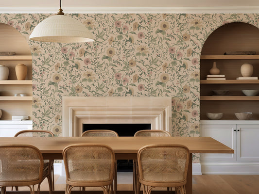 Dining room with the Clytie floral wallpaper, wooden table, and wicker chairs.