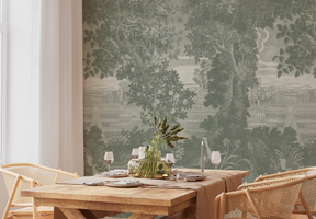 Dining room with wooden table and chairs against a wall with nature-themed wallpaper