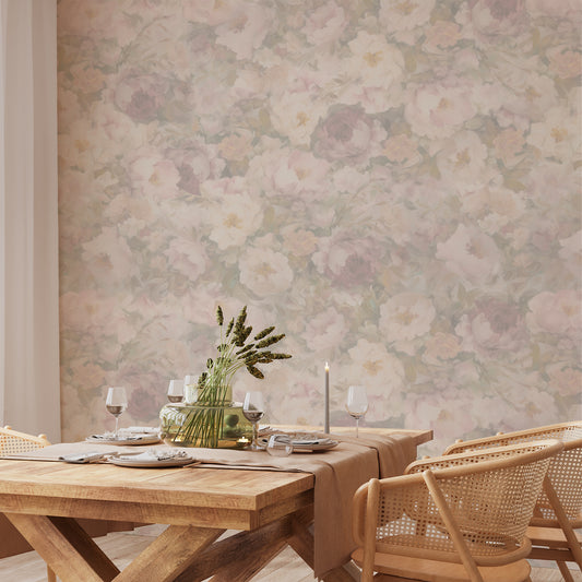 Dining room with wooden table and chairs against a floral wallpapered wall.