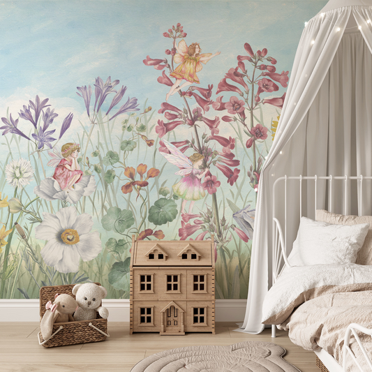 Children's room with fairy-themed wallpaper, toys, and a bed.