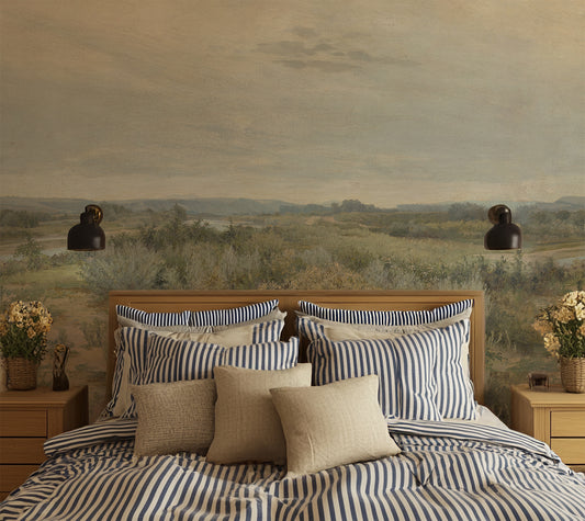 Eowyn Wallpaper in a bedroom with striped bedding and pillows against a scenic wall mural.