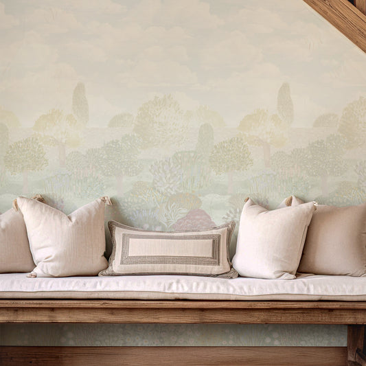 Decorative bench with pillows against a textured wall