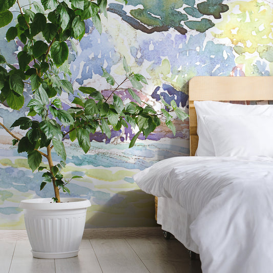 Henri Edmond Cross landscape wallpaper in bedroom with wooden be and white bedding as well as large green plant in white plant pot