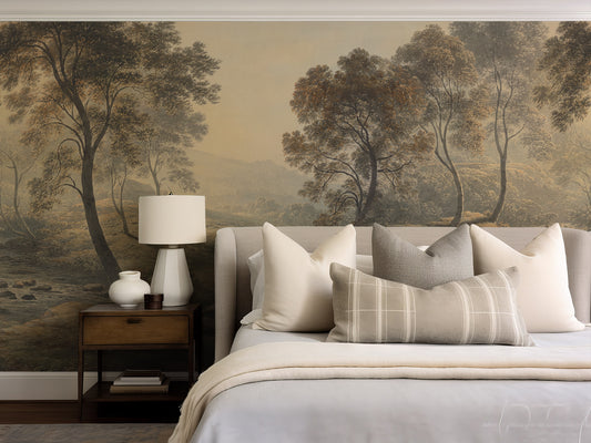 Bedroom with a large wall mural of trees, featuring a bed with pillows and a lamp.