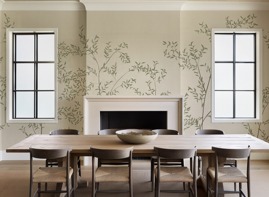 Dining room with a long wooden table and chairs, featuring a fireplace and decorative wall patterns.