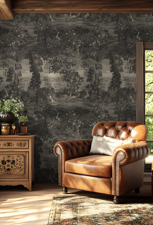 Katharine Mono Wallpaper with a brown leather armchair in a room with decorative wallpaper and wooden furniture.