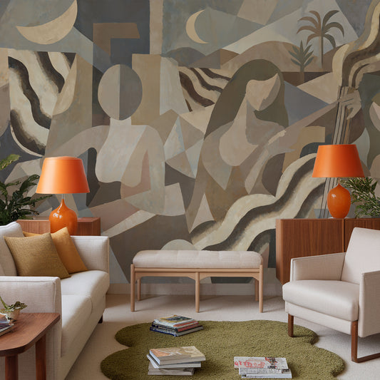Modern living room with abstract wall art, orange lamps, and a patterned rug.