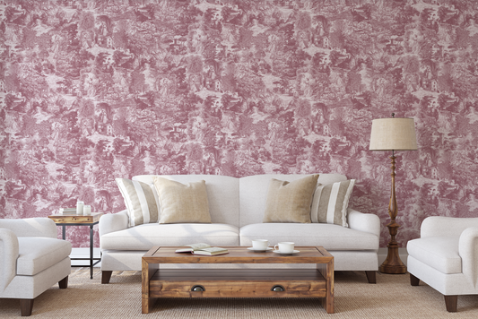 Living room with white sofa, wooden coffee table, and pink toile wallpaper.