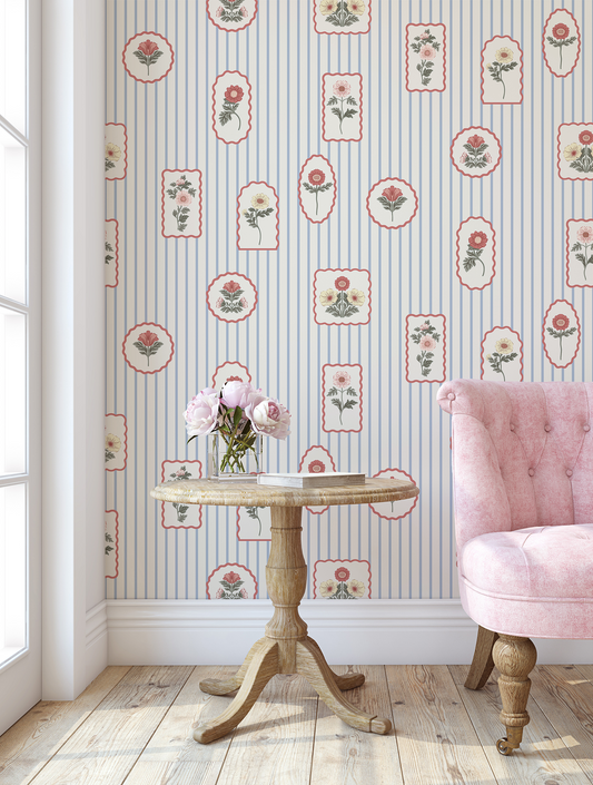 Floral stamp wallpaper in a living room with a pink chair 