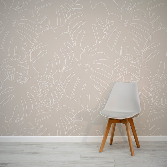 Minimal Monstera Sand Wallpaper In Room With Grey Chair