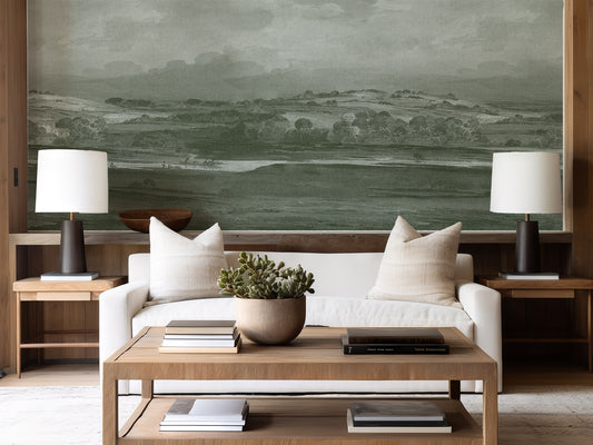 Landscape mural in a living room with a white sofa and two lamps and coffee table