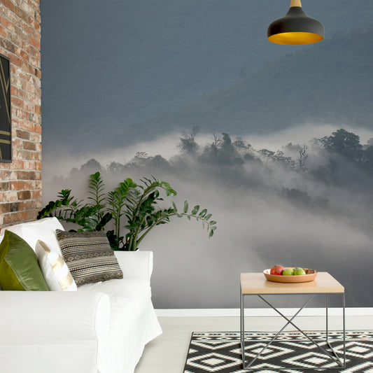 Mystical morning haze in living room with brick wall and white sofa with green cushions and green plant next to sofa and coffee table with apples on top of it