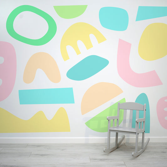 Pastel Puzzles Bright Colourful Abstract Cut-Out Shapes Wallpaper Mural with Baby Chair