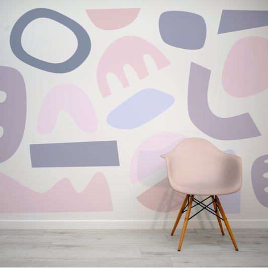 Pastel Puzzles Mauve Pink and Purple Abstract Cut-Out Shapes Wallpaper Mural with Pink Eames Chair