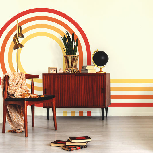 Retro Spiral Mural Reds Wallpaper in lounge with wooden cabinet and black world globe and books on top