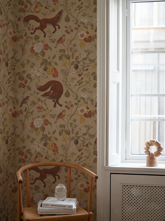 Room interior with floral wallpaper, wooden chair, and window.