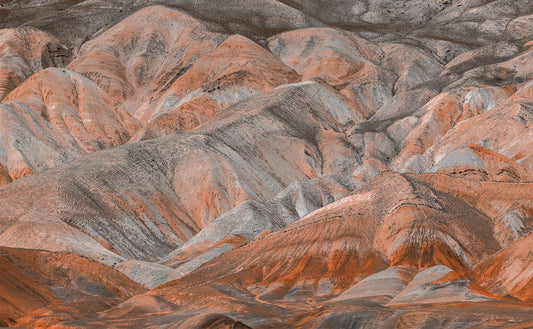 Rough, textured Desert mountain surface with orange and gray colors