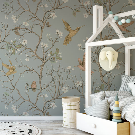 Songbird Serenade Wallpaper In Nursery Roo. With White Bed With Grey Bedding and Toys