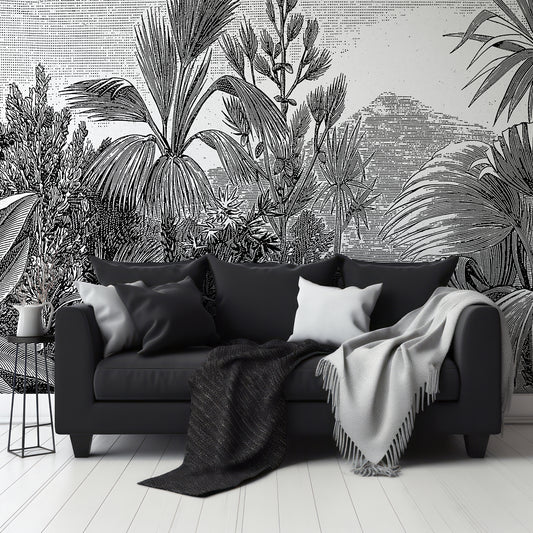The Tropics Wallpaper In Living Room With Dark Black Slofa And Grey And Black Blankets With Small Black Coffee Table