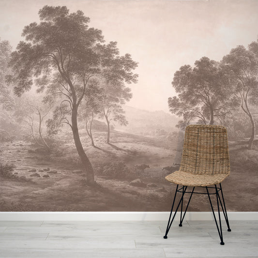 Wicker chair in front of a wall with a forest mural