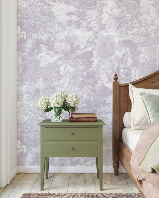 Green nightstand with flowers against a floral wallpapered wall.