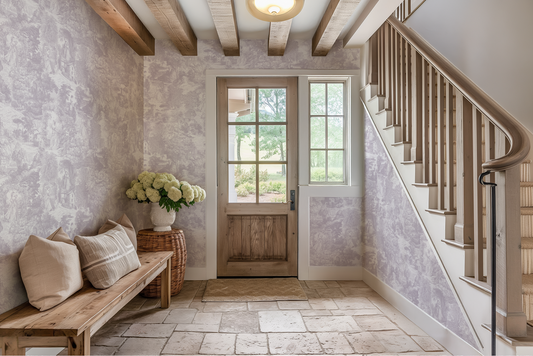Foyer with wooden bench, floral arrangement, and staircase