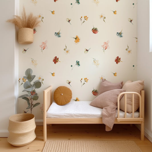 Watercolour Blossom Medley Wallpaper In Child's Bedroom With Wooden Bed and Neutral Colored Cushions and Plants