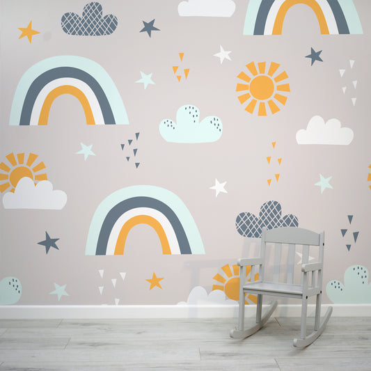 Rainbows, clouds and sun drawn in a charming illustrative style, 'Clairpor' by WallpaperMural.com looks super chic in a kids room!