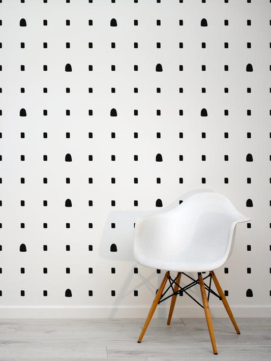Lagusan Noir Black & White Spots Wallpaper Interior with a White Eames Chair