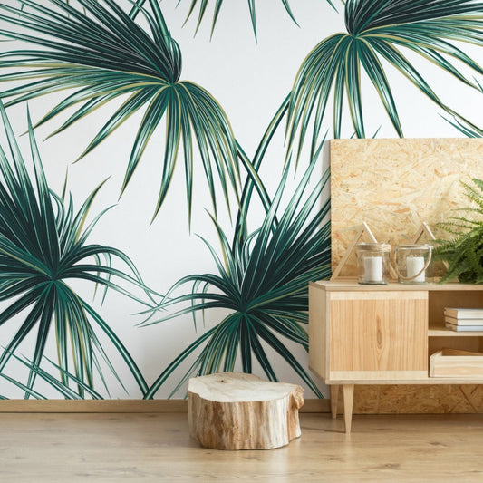 Palm Leaves wallpaper mural with a wooden sideboard and tree trunk | WallpaperMural.com